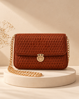 Woven Flap Chain Sling Bag — Copper Brown — warm beige pedestal product photo
