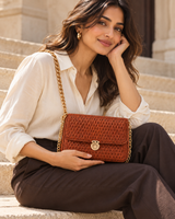 Woven Flap Chain Sling Bag — Copper Brown — model carrying the bag