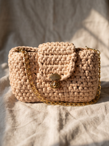 Sona Flap Bag on oatmeal linen in soft morning light, gold turn-lock detail