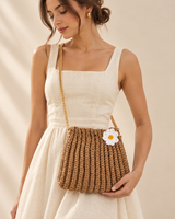 Daisy Bloom Sling Bag — model holding the bag