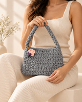 Grey Flower Charm Handbag — model holding the bag