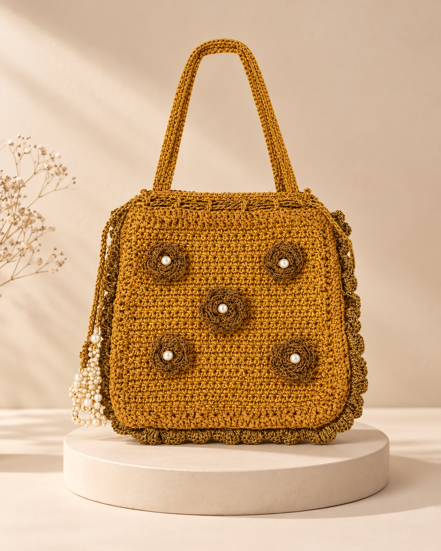 Mustard Gold Floral Potli on a cream pedestal, HouseOfReena