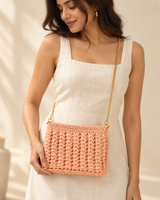 Peach Sling Bag — model holding the bag