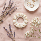Cream scrunchie in lifestyle setting