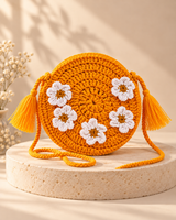 Yellow floral round crochet purse on a cream pedestal, HouseOfReena